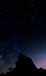 Preview wallpaper silhouette, starry sky, night, flashlight, glow