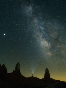 Preview wallpaper silhouette, starry sky, night, flashlight, rocks