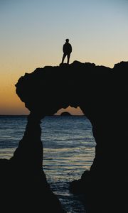 Preview wallpaper silhouette, sunset, horizon, rock