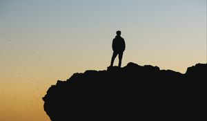 Preview wallpaper silhouette, sunset, horizon, rock