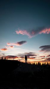 Preview wallpaper silhouette, sunset, solitude, clouds, hill, healy, united states