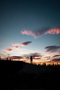 Preview wallpaper silhouette, sunset, solitude, clouds, hill, healy, united states