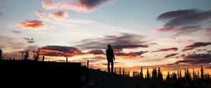 Preview wallpaper silhouette, sunset, solitude, clouds, hill, healy, united states