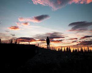 Preview wallpaper silhouette, sunset, solitude, clouds, hill, healy, united states