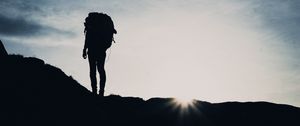 Preview wallpaper silhouette, tourist, hill, backpack