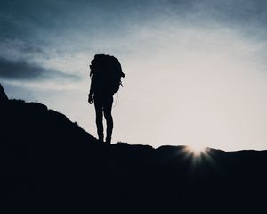 Preview wallpaper silhouette, tourist, hill, backpack