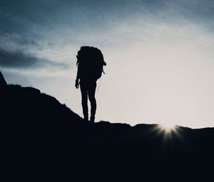 Preview wallpaper silhouette, tourist, hill, backpack