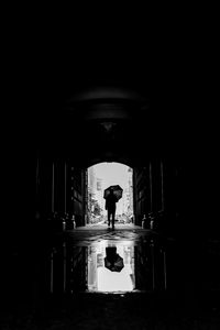 Preview wallpaper silhouette, umbrella, bw, passage, dark