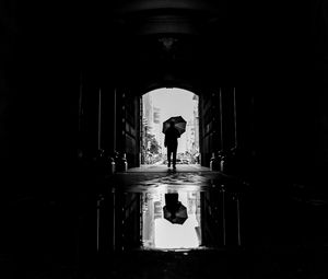 Preview wallpaper silhouette, umbrella, bw, passage, dark