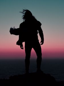 Preview wallpaper silhouette, wind, man, sunset, night