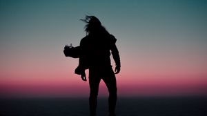 Preview wallpaper silhouette, wind, man, sunset, night