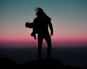 Preview wallpaper silhouette, wind, man, sunset, night