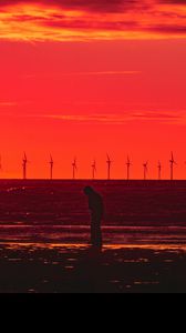 Preview wallpaper silhouette, wind turbines, sunset, horizon, red