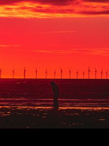 Preview wallpaper silhouette, wind turbines, sunset, horizon, red