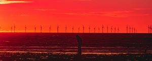 Preview wallpaper silhouette, wind turbines, sunset, horizon, red