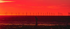 Preview wallpaper silhouette, wind turbines, sunset, horizon, red