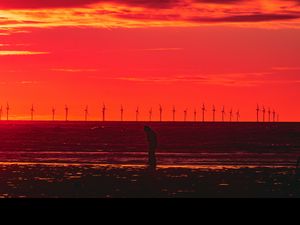 Preview wallpaper silhouette, wind turbines, sunset, horizon, red