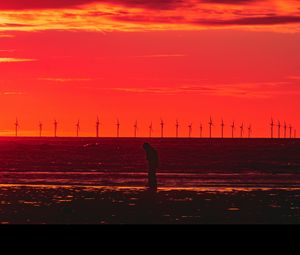 Preview wallpaper silhouette, wind turbines, sunset, horizon, red