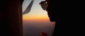 Preview wallpaper silhouette, window, porthole, flight