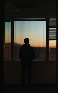 Preview wallpaper silhouette, window, sunset, loneliness, solitude