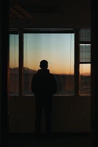 Preview wallpaper silhouette, window, sunset, loneliness, solitude