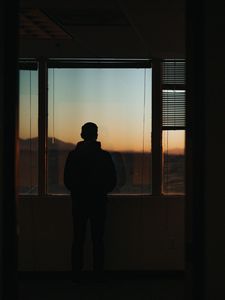 Preview wallpaper silhouette, window, sunset, loneliness, solitude