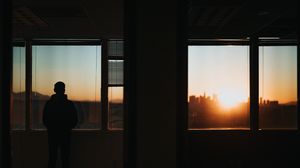 Preview wallpaper silhouette, window, sunset, loneliness, solitude