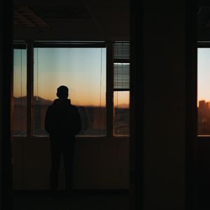 Preview wallpaper silhouette, window, sunset, loneliness, solitude