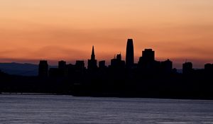 Preview wallpaper silhouettes, buildings, city, river, evening