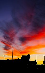 Preview wallpaper silhouettes, city, buildings, clouds, colorful, sunset, sky, dark