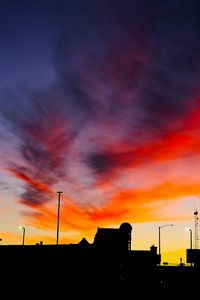 Preview wallpaper silhouettes, city, buildings, clouds, colorful, sunset, sky, dark