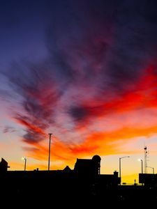 Preview wallpaper silhouettes, city, buildings, clouds, colorful, sunset, sky, dark