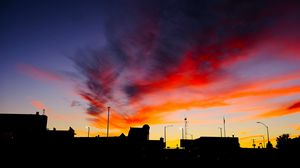 Preview wallpaper silhouettes, city, buildings, clouds, colorful, sunset, sky, dark