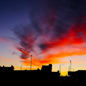 Preview wallpaper silhouettes, city, buildings, clouds, colorful, sunset, sky, dark