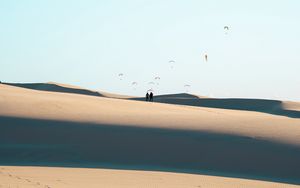 Preview wallpaper silhouettes, couple, desert, sand