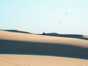 Preview wallpaper silhouettes, couple, desert, sand