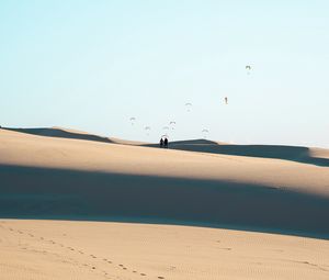 Preview wallpaper silhouettes, couple, desert, sand