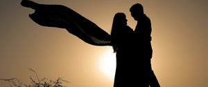 Preview wallpaper silhouettes, couple, hugs, romance, sunset, dark