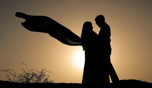 Preview wallpaper silhouettes, couple, hugs, romance, sunset, dark