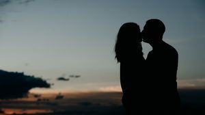 Preview wallpaper silhouettes, kiss, couple, love, hugs, romance, night
