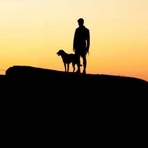 Preview wallpaper silhouettes, man, dog, sunset, hill