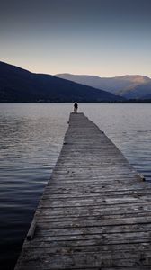 Preview wallpaper silhouettes, pier, lake, water, mountains, nature