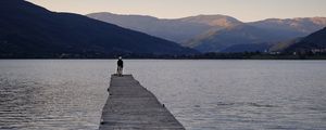 Preview wallpaper silhouettes, pier, lake, water, mountains, nature