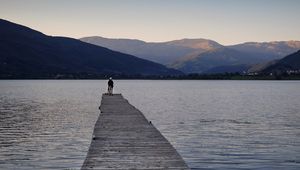 Preview wallpaper silhouettes, pier, lake, water, mountains, nature