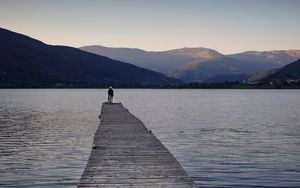 Preview wallpaper silhouettes, pier, lake, water, mountains, nature