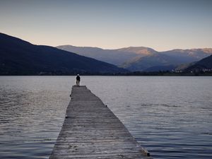 Preview wallpaper silhouettes, pier, lake, water, mountains, nature