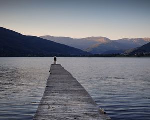 Preview wallpaper silhouettes, pier, lake, water, mountains, nature