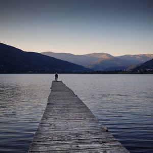 Preview wallpaper silhouettes, pier, lake, water, mountains, nature