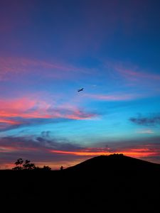 Preview wallpaper silhouettes, plane, horizon, mountain, sunset, landscape