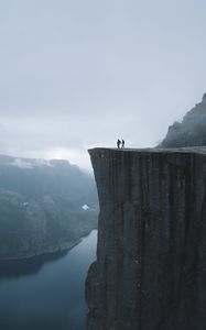 Preview wallpaper silhouettes, rock, cliff, lake, mist